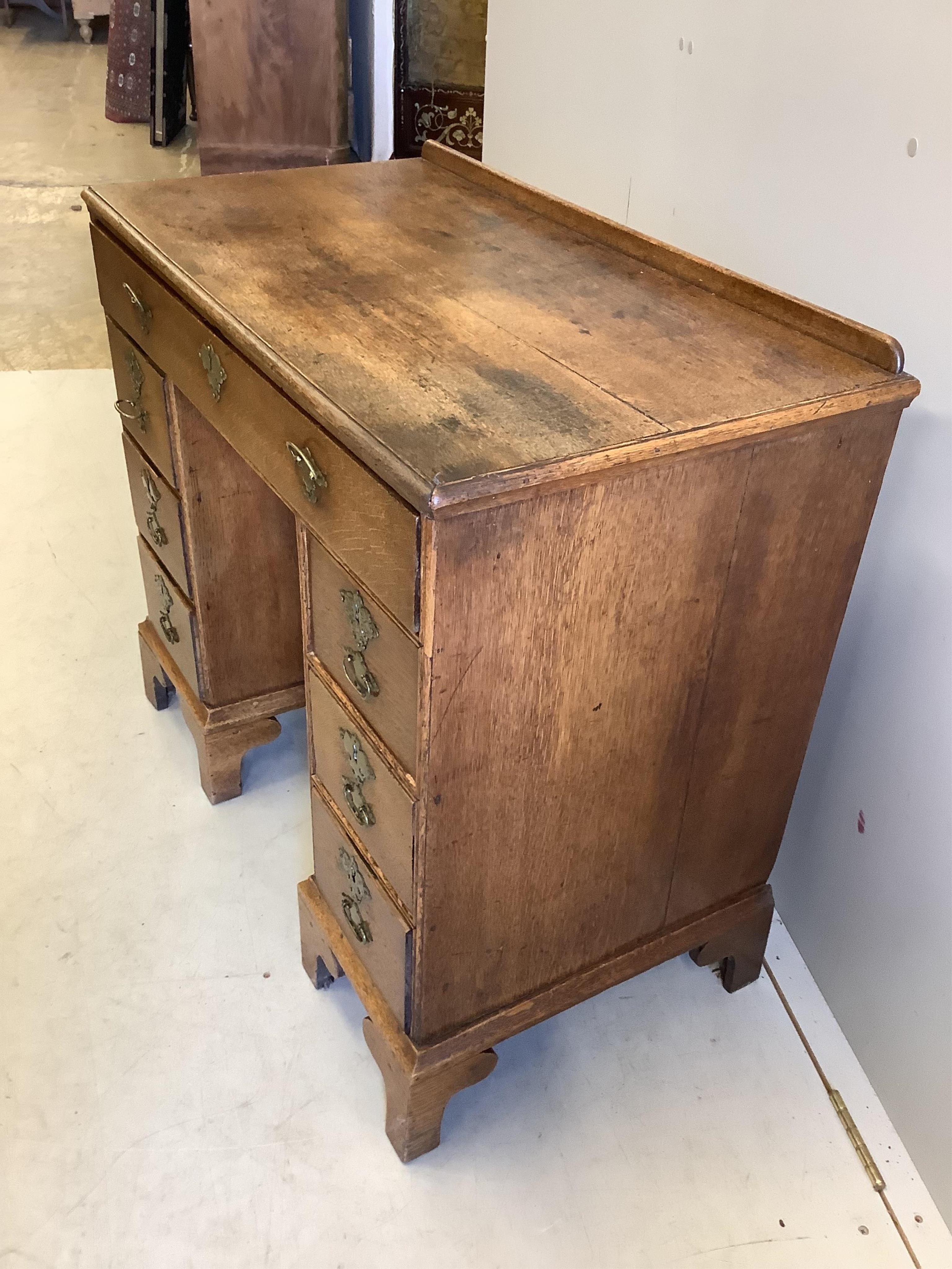 A George lll Provincial oak kneehole desk, width 86cm, depth 46cm, height 78cm. Condition - fair